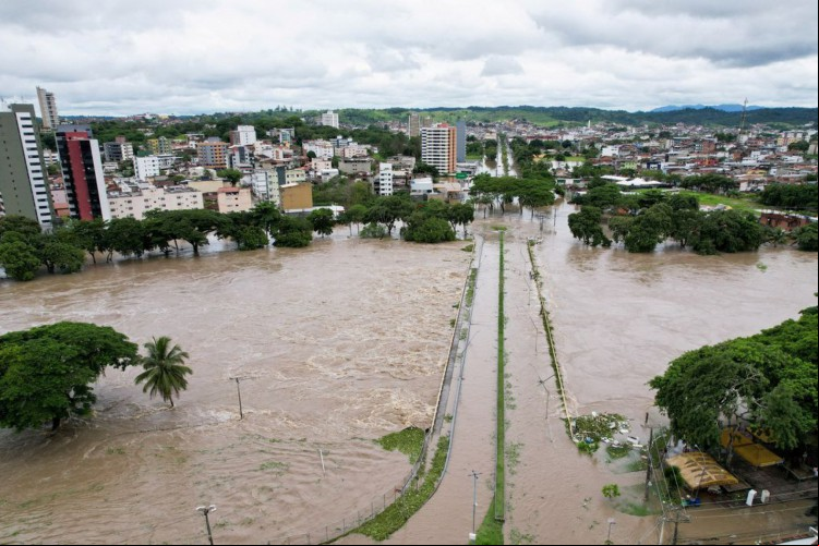 An aerial view shows a neighbourhood during flooding caused by the overflowing Cachoeira river in Itabuna, Bahia state, Brazil, December 26, 2021. Picture taken with a drone. REUTERS/Leonardo Benassatto NO RESALES. NO ARCHIVES