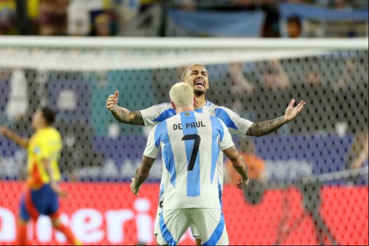Argentina's midfielder #07 Rodrigo De Paul and Argentina's forward #05 Leandro Paredes celebrate their team's first goal during the Conmebol 2024 Copa America tournament final football match between Argentina and Colombia at the Hard Rock Stadium, in Miami, Florida on July 14, 2024. (Photo by CHARLY TRIBALLEAU / AFP) (Photo by CHARLY TRIBALLEAU/AFP via Getty Images)