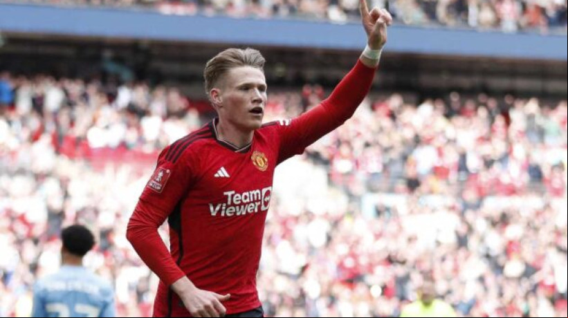 Manchester United's Scottish midfielder #39 Scott McTominay celebrates after scoring the opening goal of the English FA Cup semi-final football match between Coventry City and Manchester United at Wembley Stadium in north west London on April 21, 2024. (Photo by Ian Kington / AFP) / NOT FOR MARKETING OR ADVERTISING USE / RESTRICTED TO EDITORIAL USE (Photo by IAN KINGTON/AFP via Getty Images) 